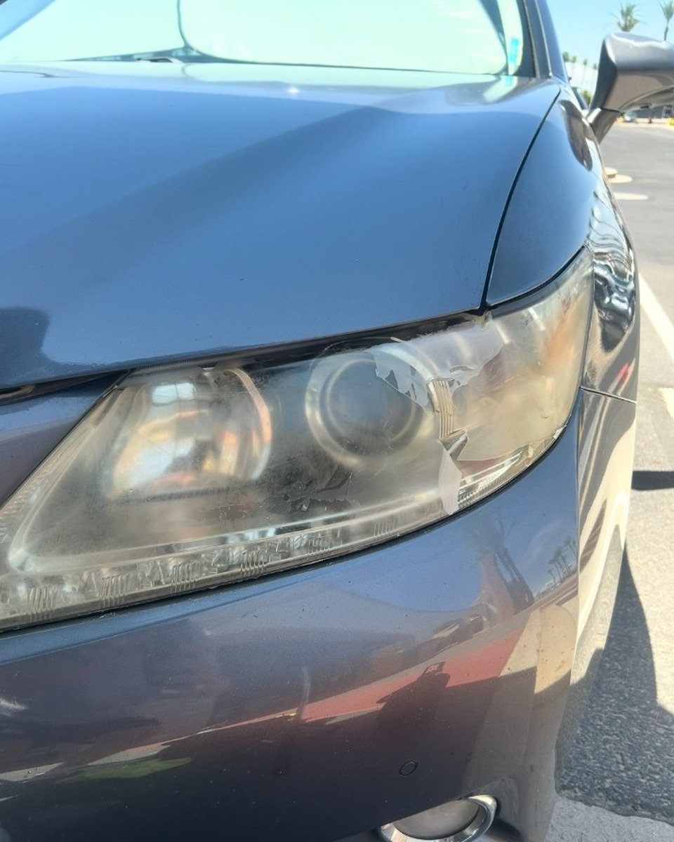 Cloudy oxidized yellow headlight before restoration